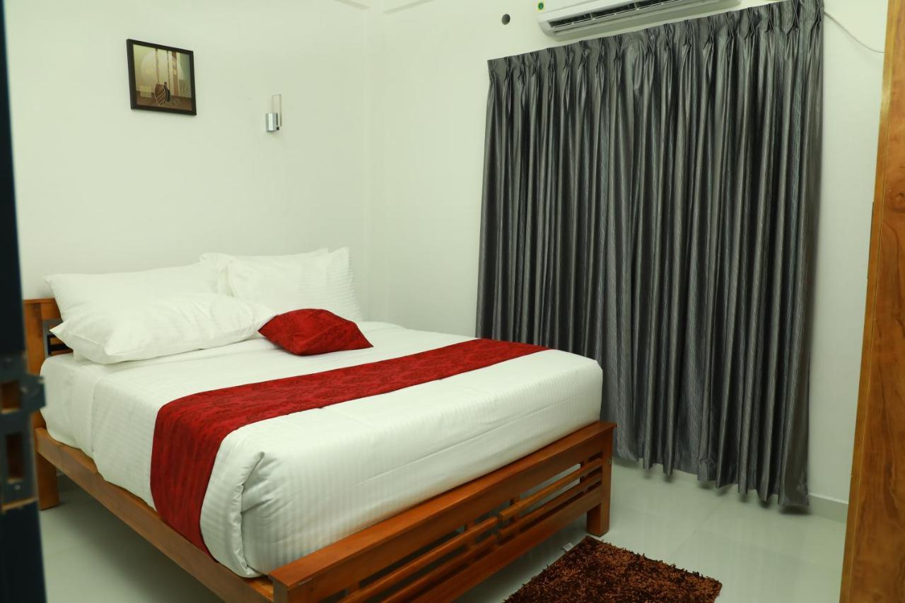 Hotel Achoos Residency Tiruvalla Exterior foto