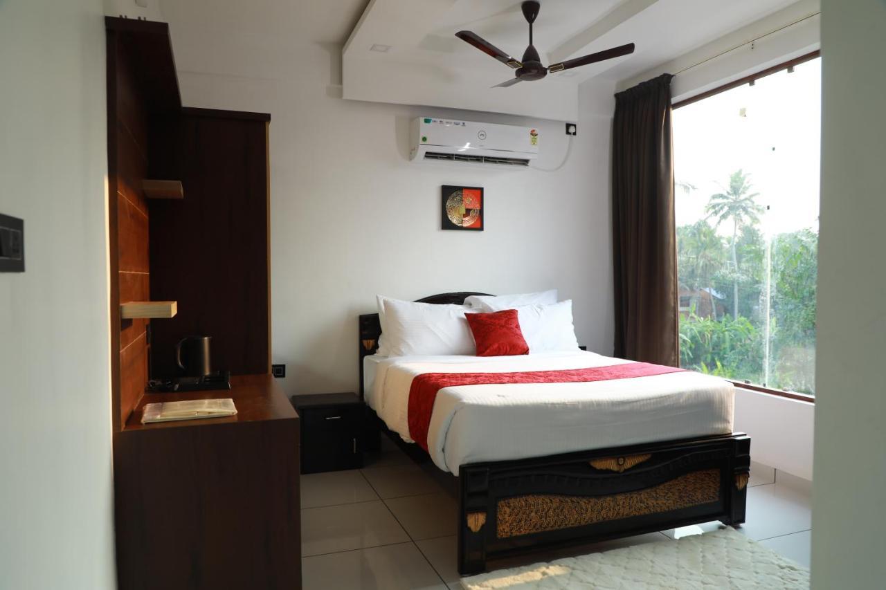 Hotel Achoos Residency Tiruvalla Exterior foto